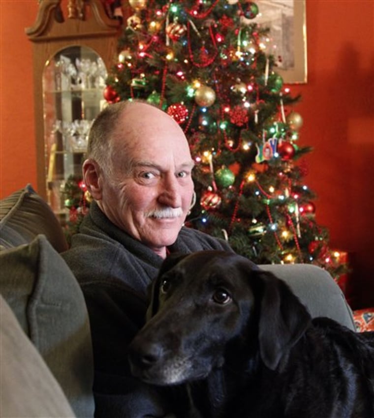Ted Szal sits with his dog at his home Wednesday, Dec. 21, 2011, in Beaverton, Ore. Szal says he had no idea that his family back in the Chicago area feared he may have been killed by serial killer John Wayne Gacy.
